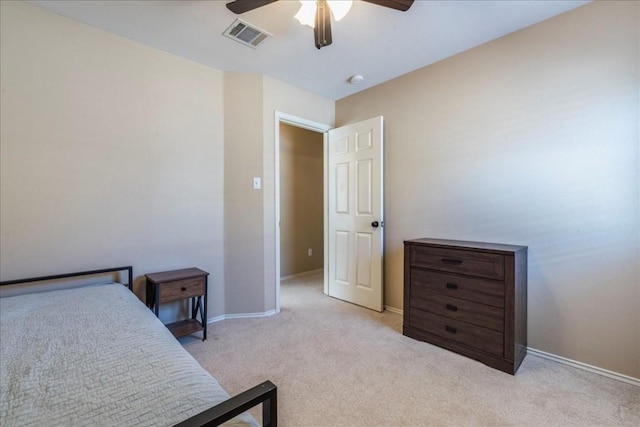 bedroom with ceiling fan and light carpet