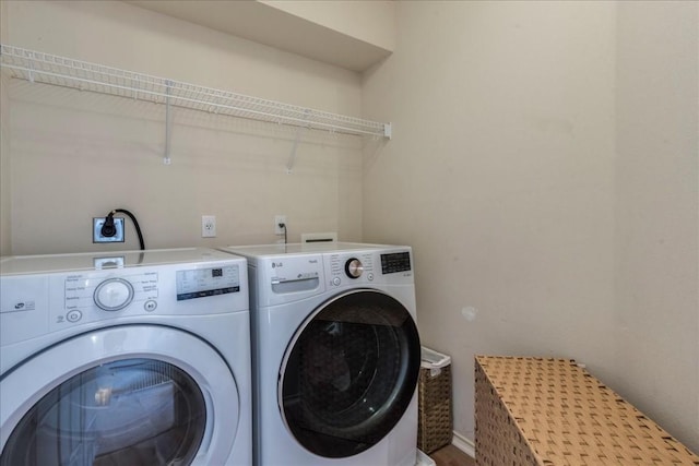 washroom featuring washer and dryer