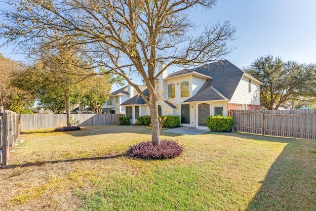 view of front facade with a front lawn