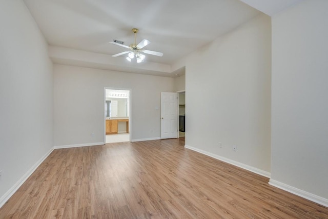 empty room featuring light hardwood / wood-style floors and ceiling fan