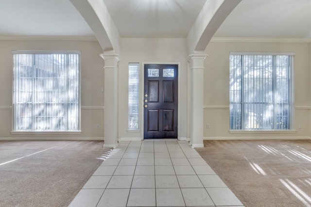 foyer featuring beam ceiling and a wealth of natural light