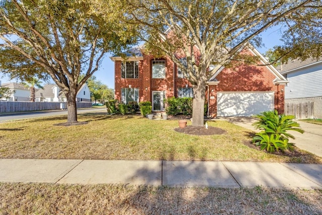 712 Runners Rdg, Pflugerville, TX 78660 - view of front of home featuring fence, a front yard, a garage, and brick siding