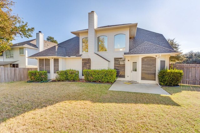 712 Runners Rdg, Pflugerville, TX 78660 - rear view of house featuring a patio, roof with shingles, and a chimney