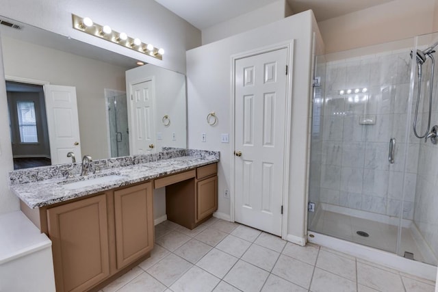 712 Runners Rdg, Pflugerville, TX 78660 - full bathroom featuring double vanity, tile patterned floors, and a shower stall