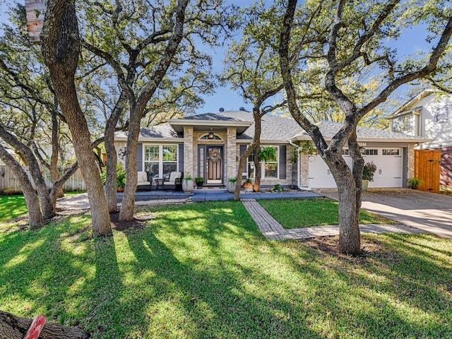 view of front facade with a front yard and a garage