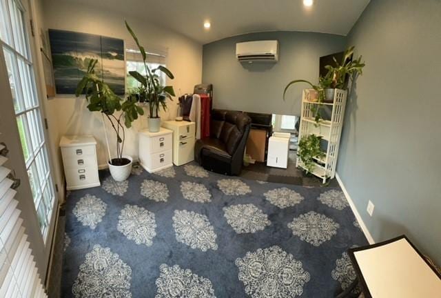 living area featuring a wall unit AC