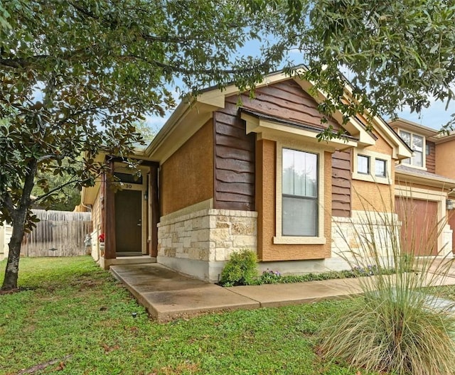 view of side of home featuring a lawn