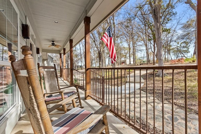 balcony featuring a ceiling fan and covered porch