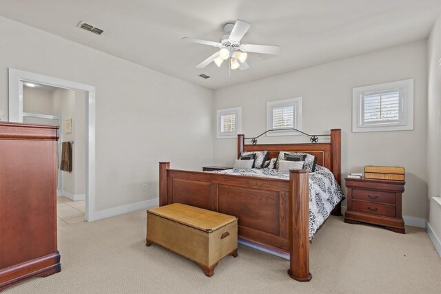 bedroom with light colored carpet and ceiling fan