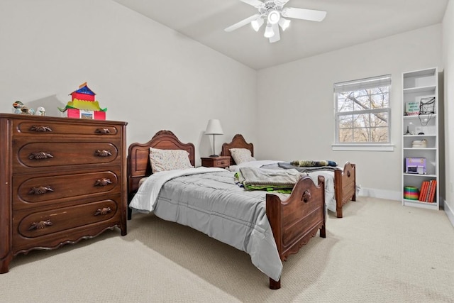 bedroom with ceiling fan and light carpet