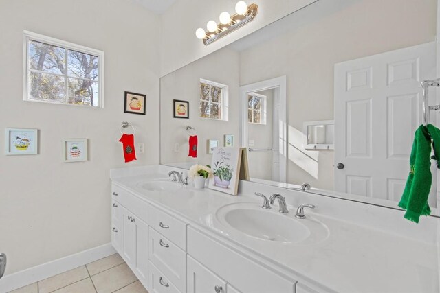 bathroom with tile patterned flooring and vanity