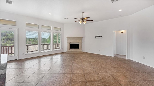 unfurnished living room with ceiling fan and tile patterned flooring