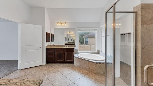 bathroom featuring tile patterned floors, vanity, and separate shower and tub