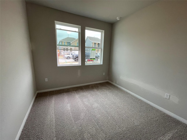 unfurnished room with carpet floors