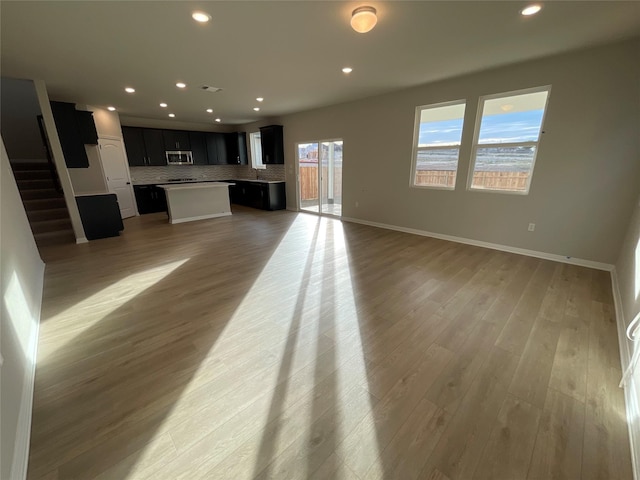 unfurnished living room featuring light hardwood / wood-style flooring