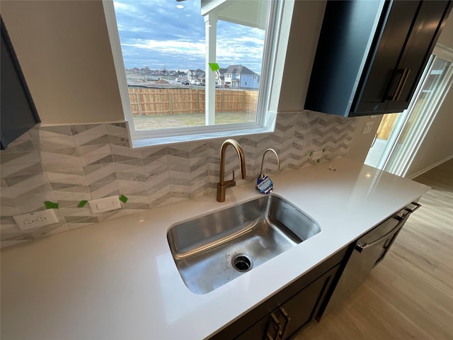 kitchen with light wood-type flooring and sink