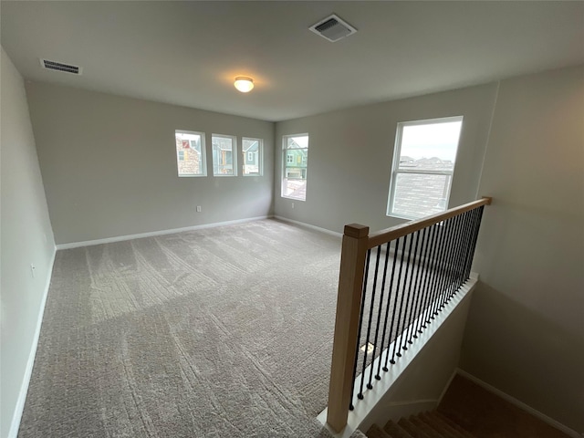 spare room featuring carpet flooring