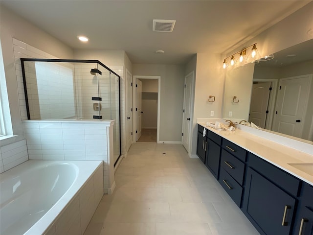 bathroom featuring vanity, separate shower and tub, and tile patterned flooring