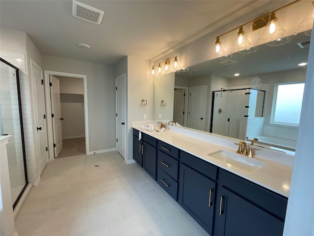 bathroom featuring vanity and shower with separate bathtub