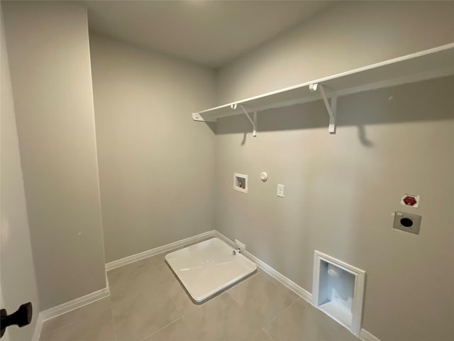 washroom with hookup for a gas dryer, light tile patterned floors, hookup for an electric dryer, and hookup for a washing machine