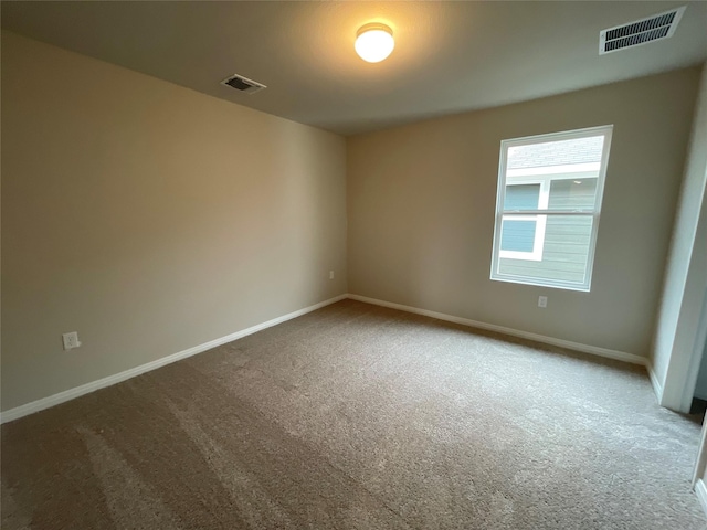 spare room featuring carpet flooring