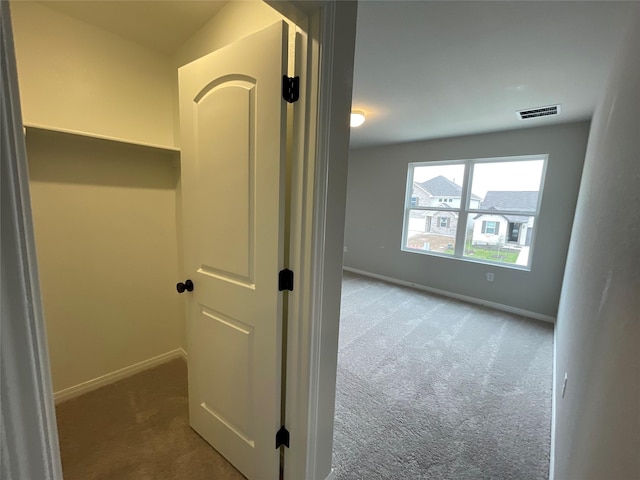 hallway featuring carpet