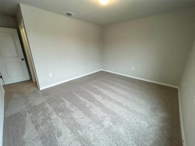 empty room featuring carpet floors