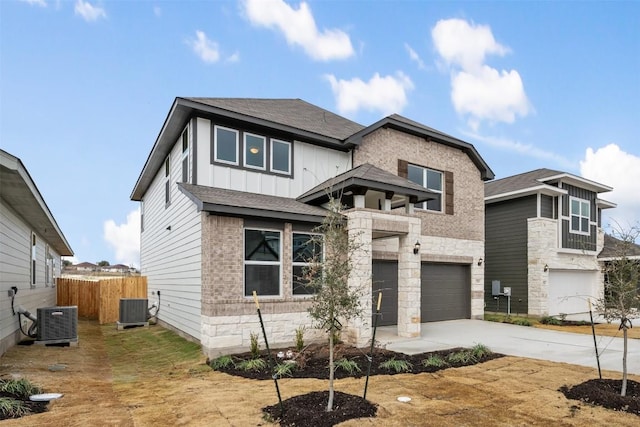 view of front facade with a garage and cooling unit