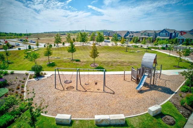 view of jungle gym with a lawn