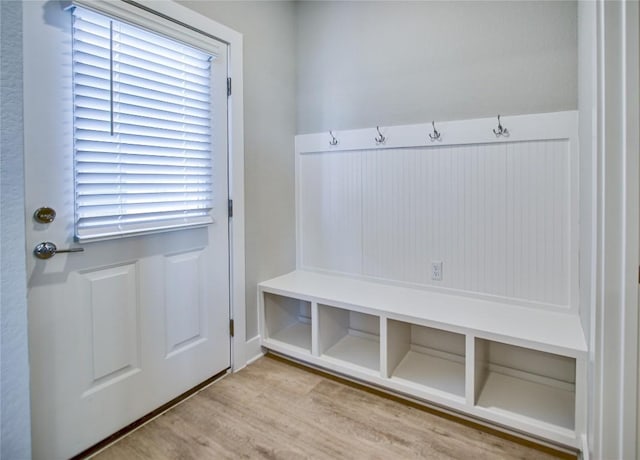 mudroom with plenty of natural light and light hardwood / wood-style floors