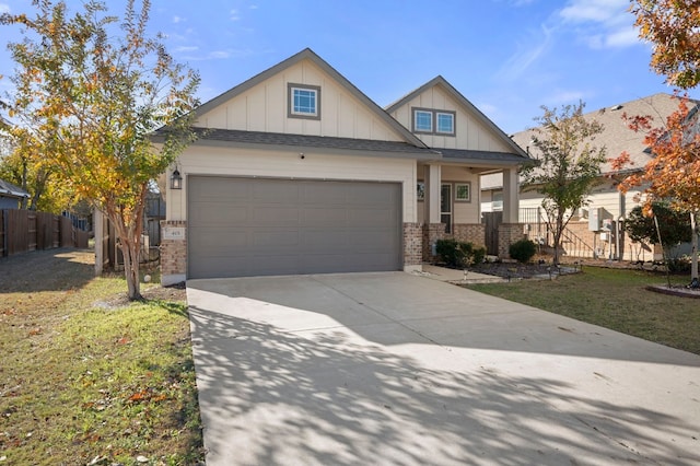 craftsman inspired home featuring board and batten siding, brick siding, driveway, and an attached garage