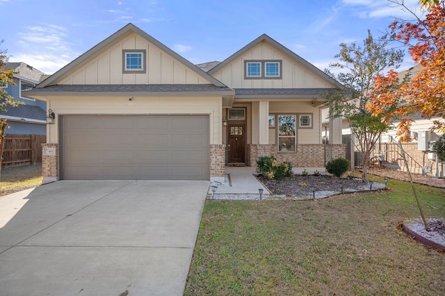 craftsman house with board and batten siding, concrete driveway, brick siding, and a garage