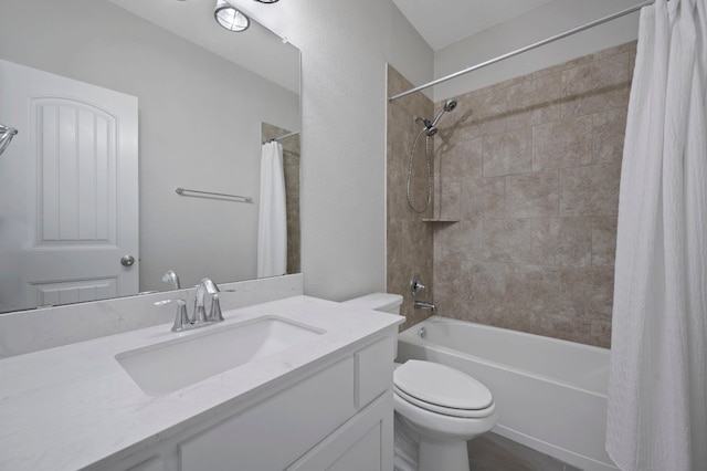 bathroom with vanity, toilet, and shower / bath combo with shower curtain