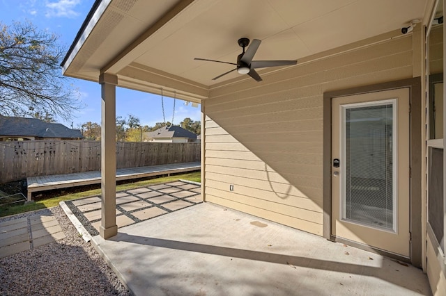 view of patio / terrace featuring ceiling fan and fence