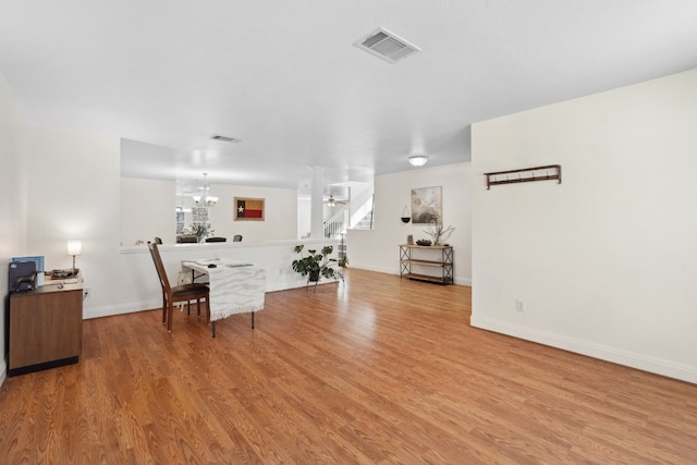 interior space featuring light hardwood / wood-style flooring and a chandelier