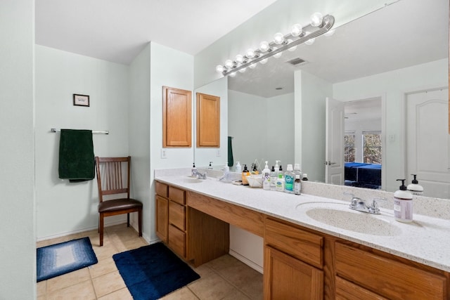 bathroom featuring tile patterned flooring and vanity