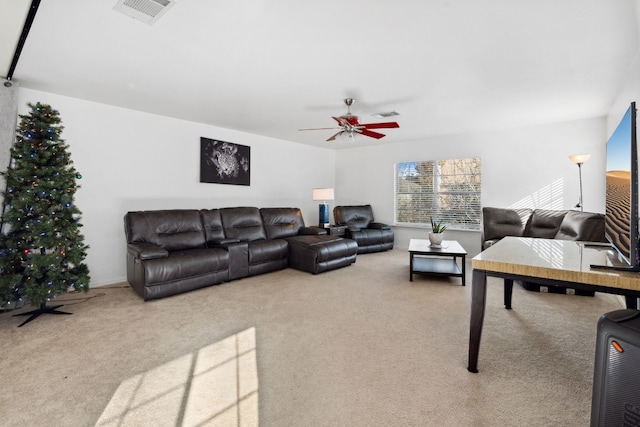 living room featuring carpet flooring and ceiling fan