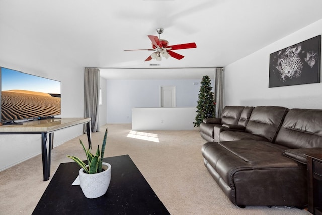 living room with light colored carpet and ceiling fan