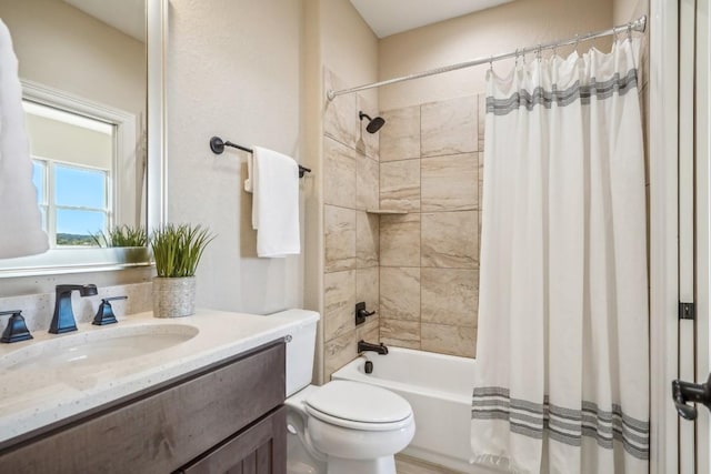 bathroom with toilet, shower / tub combo with curtain, and vanity