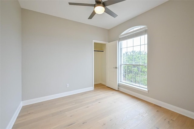 unfurnished bedroom featuring light hardwood / wood-style floors and ceiling fan