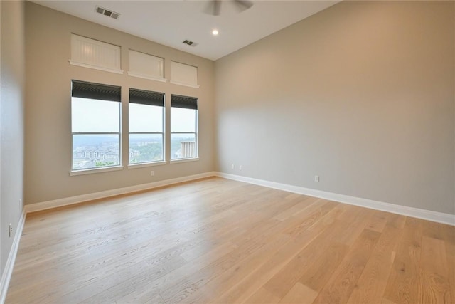 spare room with light wood-type flooring