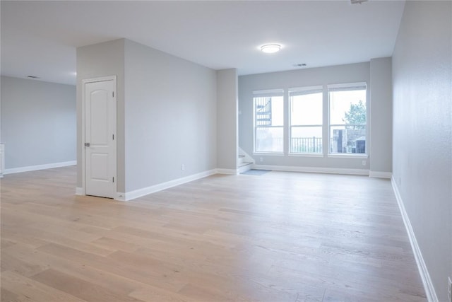 spare room with light wood-type flooring