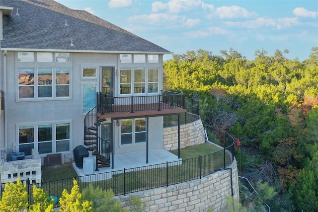 back of house with a patio area