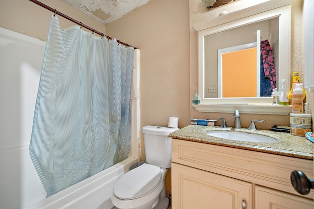 full bathroom featuring vanity, shower / bath combination with curtain, a textured ceiling, and toilet