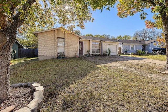 ranch-style home with a garage and a front lawn