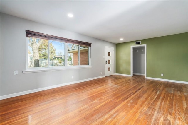 spare room featuring hardwood / wood-style floors