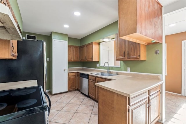 kitchen with kitchen peninsula, light tile patterned floors, stainless steel appliances, and sink