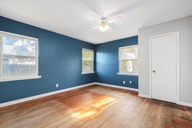 unfurnished bedroom with hardwood / wood-style flooring and ceiling fan