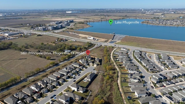 bird's eye view featuring a residential view and a water view