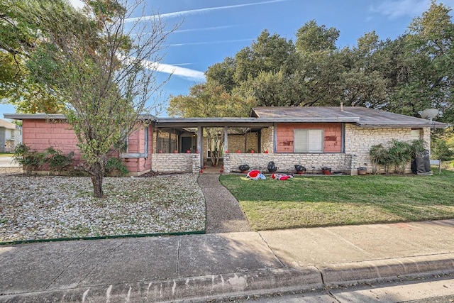 single story home featuring a front lawn